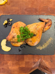 Cooked chicken thigh with lemon and olives - 1 serving